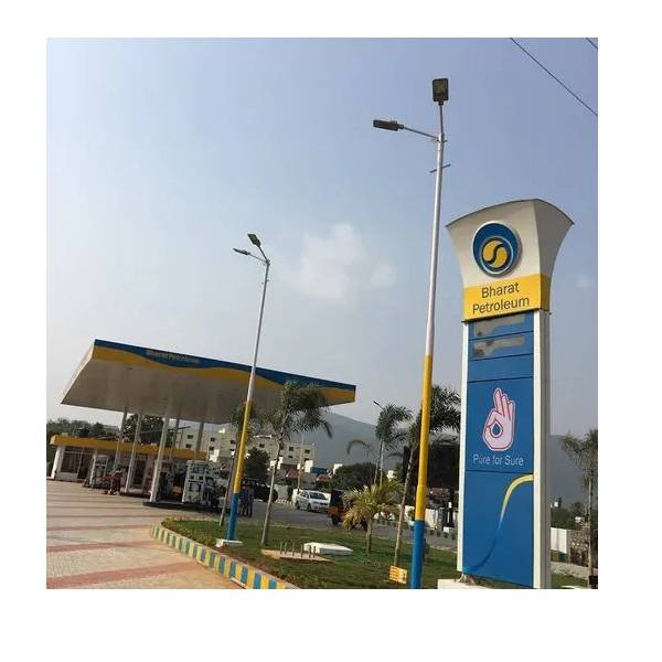 gas station with a sign and a building